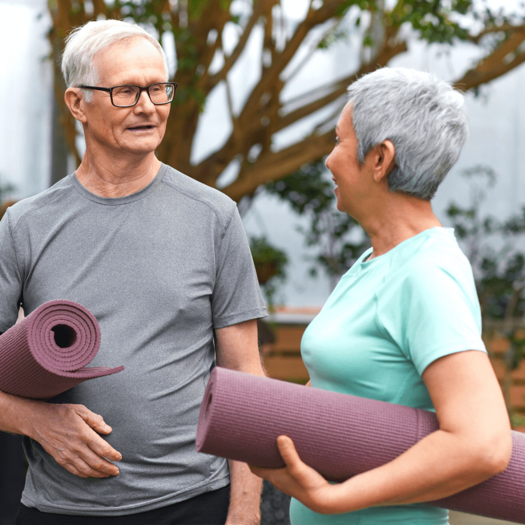 Two friends taking part in a pilates class to improve strength and muscle quality.